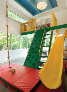 at-the-end-of-a-hall-in-this-home-is-a-14x22-foot-sharpplayroom-that-includes-an-indoor-jungle-gym-rock-climbing-wall-rope-swing-and-a-door-to-the-deck.-sharphousetrends